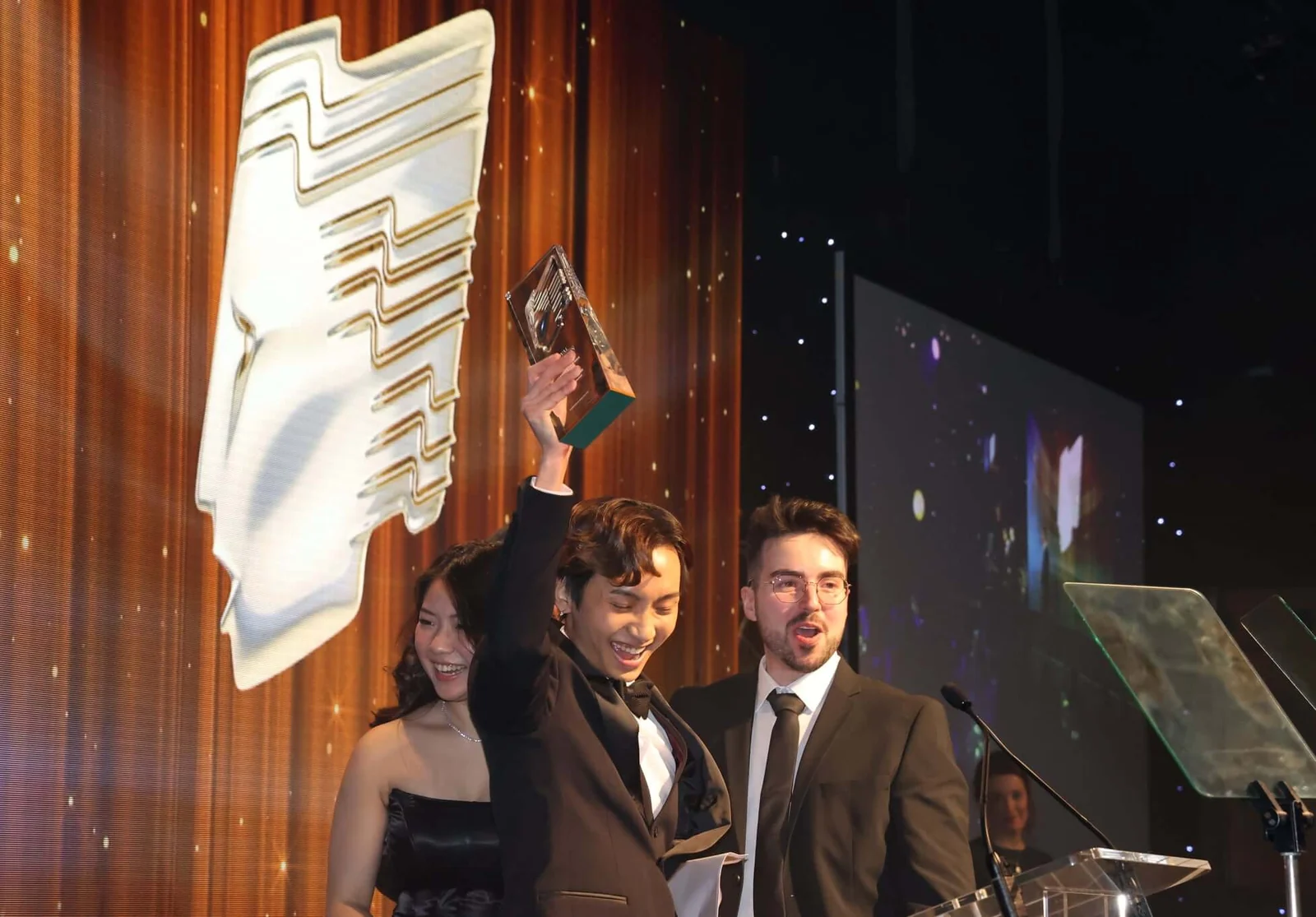Collecting the Royal Television Society North East and the Borders award on stage, February 2022